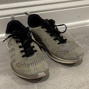 APL Women's Gold and Black Athletic Shoes